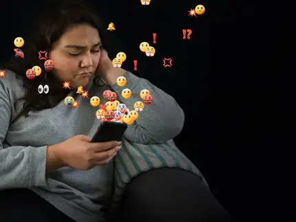 A woman looks at her phone concerned. AI powered abuse is threatening women and girls everywhere. There is no excuse for online abuse. Photo: UN Women